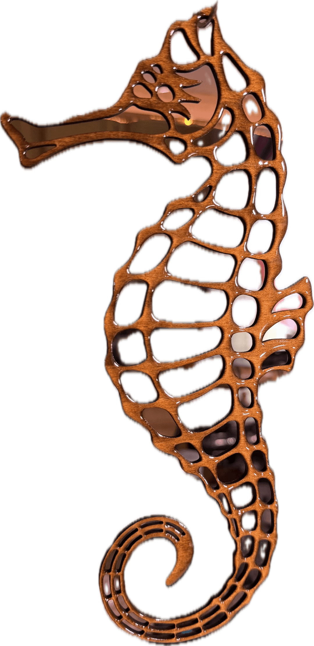 Decorative brown seahorse with an intricate lattice cutout pattern and a curled tail.